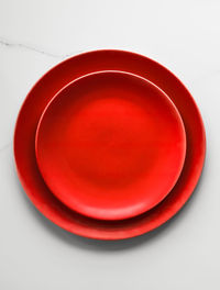 Directly above shot of empty plate on white background