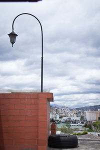 Street light against buildings in city