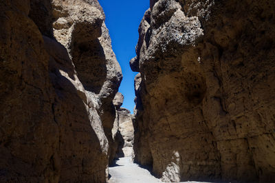 Low angle view of rock formation against sky