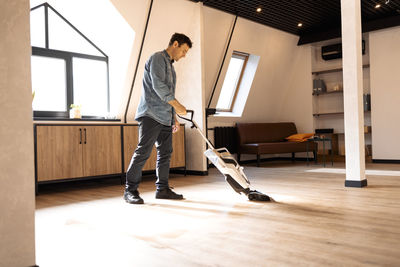 Low section of man standing on floor