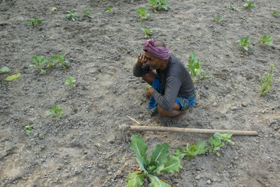 High angle view of woman working on field