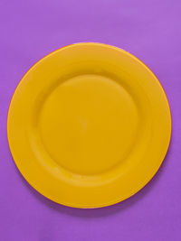 High angle view of yellow juice on table