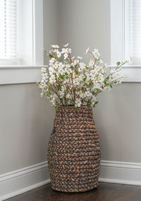 Close-up of white flower vase on table at home