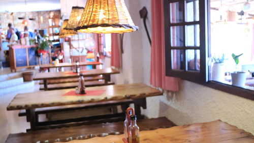 Close-up of lamp hanging on table at home