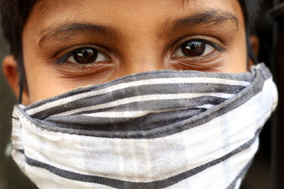 Close-up portrait of mid adult man covering face