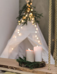 Close-up of illuminated christmas tree on table
