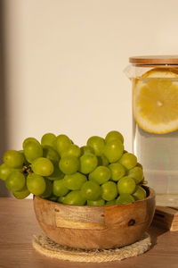 Green grapes lie on eco dish. eco-friendly choice and friendly nature. the concept of world without