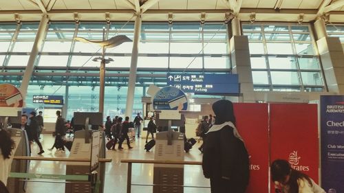 People walking on railroad station