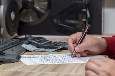 Close-up of person working on table