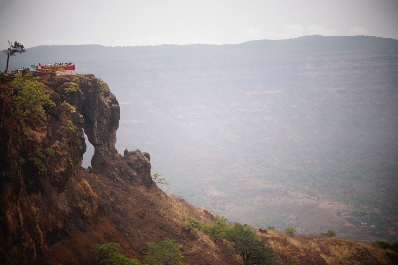 mountain, nature, beauty in nature, scenics, outdoors, landscape, sky, tranquility, real people, day, architecture, tree, water