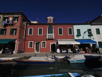 View of buildings in city against clear sky