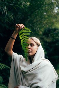 Rear view of woman standing outdoors