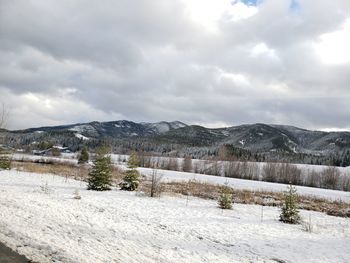 Scenic view of snowcapped mountains against sky