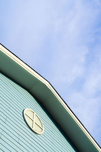 Low angle view of text on building against sky