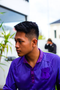 Portrait of young man looking away