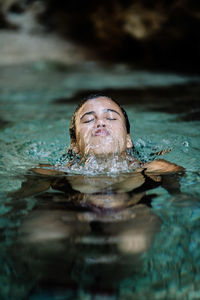 Woman swimming in lake