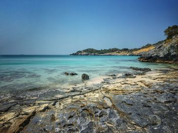 Scenic view of sea against clear blue sky