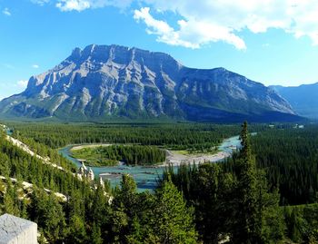 Tranquil view of mountains against cloudy sky