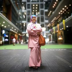 Portrait of smiling woman standing outdoors