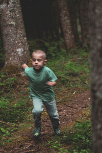 Full length of boy in forest