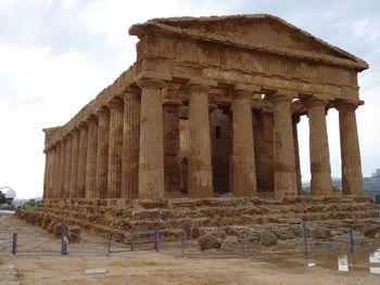 Old ruins of building against cloudy sky