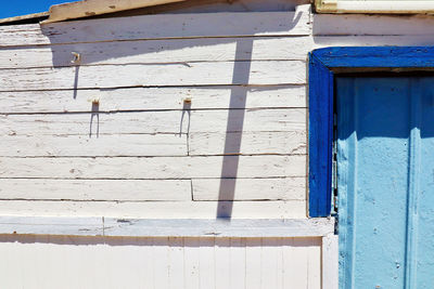 Closed blue door of old building