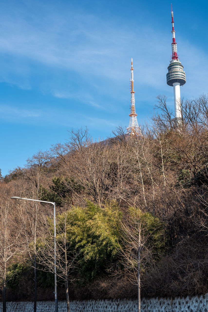 tower, communications tower, sky, architecture, built structure, technology, broadcasting, communication, nature, travel destinations, building exterior, no people, plant, travel, television industry, global communications, tourism, building, outdoors, cloud, day, blue, tree, city, landscape, security, antenna