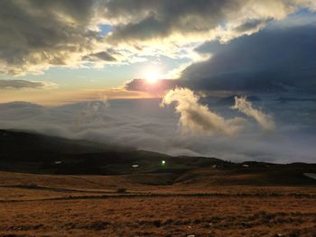 Scenic view of landscape against sky during sunset