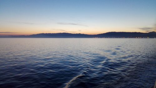 Scenic view of sea against sky at sunset