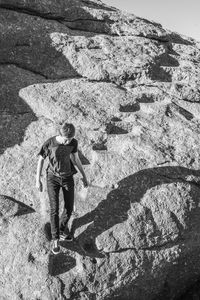 Shadow of man walking on mountain