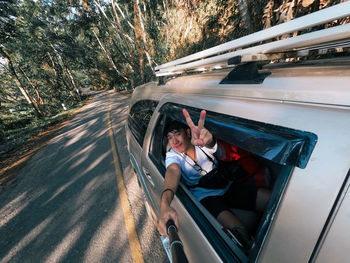 Portrait of woman sitting in car