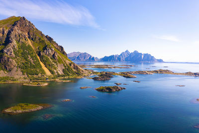 Panoramic view of sea and mountains against sky