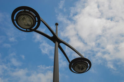 Low angle view of street light against sky