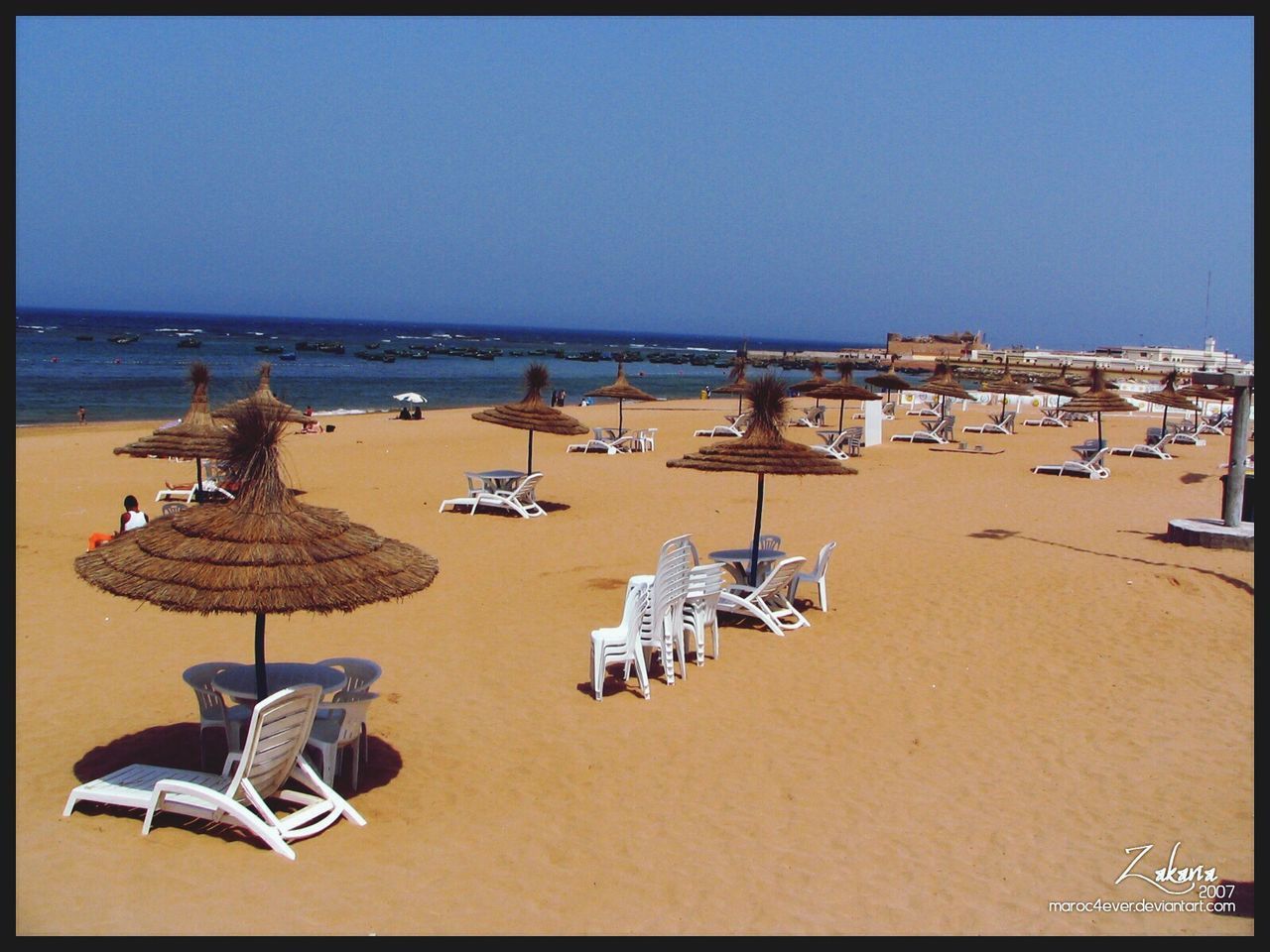 beach, sea, sand, clear sky, horizon over water, shore, water, beach umbrella, copy space, parasol, vacations, summer, absence, lounge chair, tranquil scene, deck chair, sunlight, sunshade, chair, tranquility