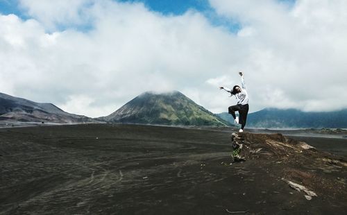 Man on mountain against sky