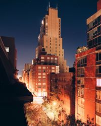 Modern buildings in city at night