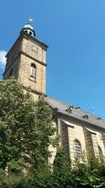 Low angle view of church against blue sky