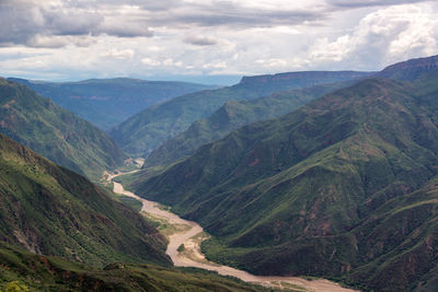 Scenic view of mountains against cloudy sky at chicamocha canyon