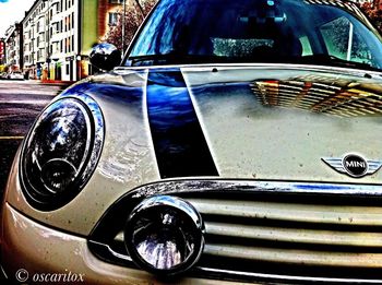 Close-up of vintage car on street