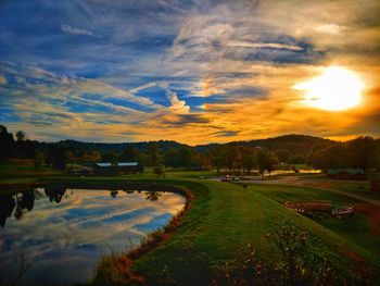 Scenic view of lake against sky during sunset