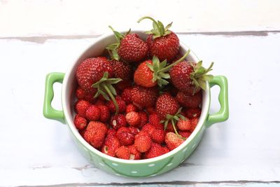 High angle view of strawberries in container on table