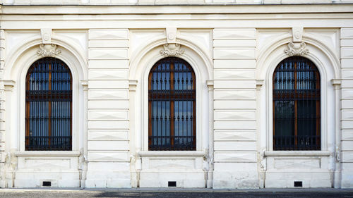 Three windows with ornaments of belvedere palace, vienna, austria