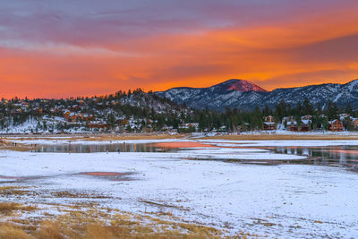 Scenic view of snowcapped mountains against sky during sunset