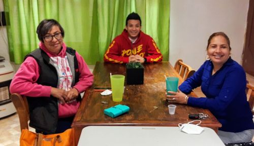 Portrait of a smiling girl sitting on table