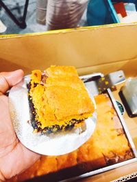 Close-up of hand holding ice cream