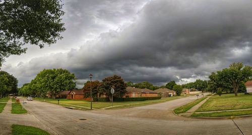 Panoramic view of trees against cloudy sky