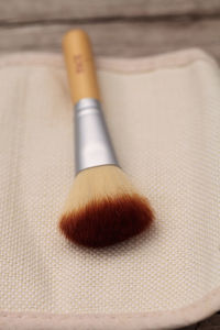Close up of make-up brush on table
