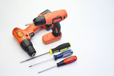 High angle view of tools on table against white background