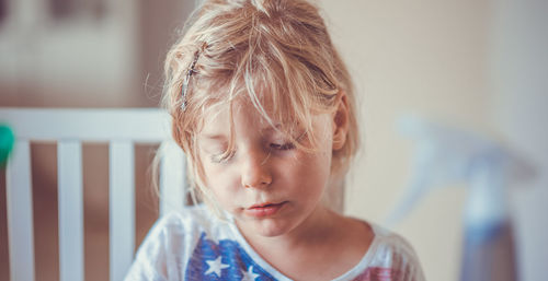 Close-up of cute girl at home