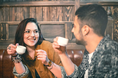 Portrait of smiling young man with coffee